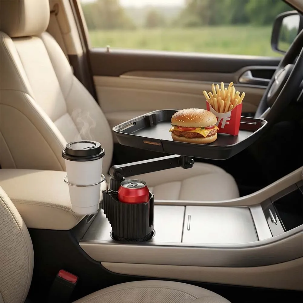 Black cup-holder tray with a meal, upright phone and separate drink holders inside a car